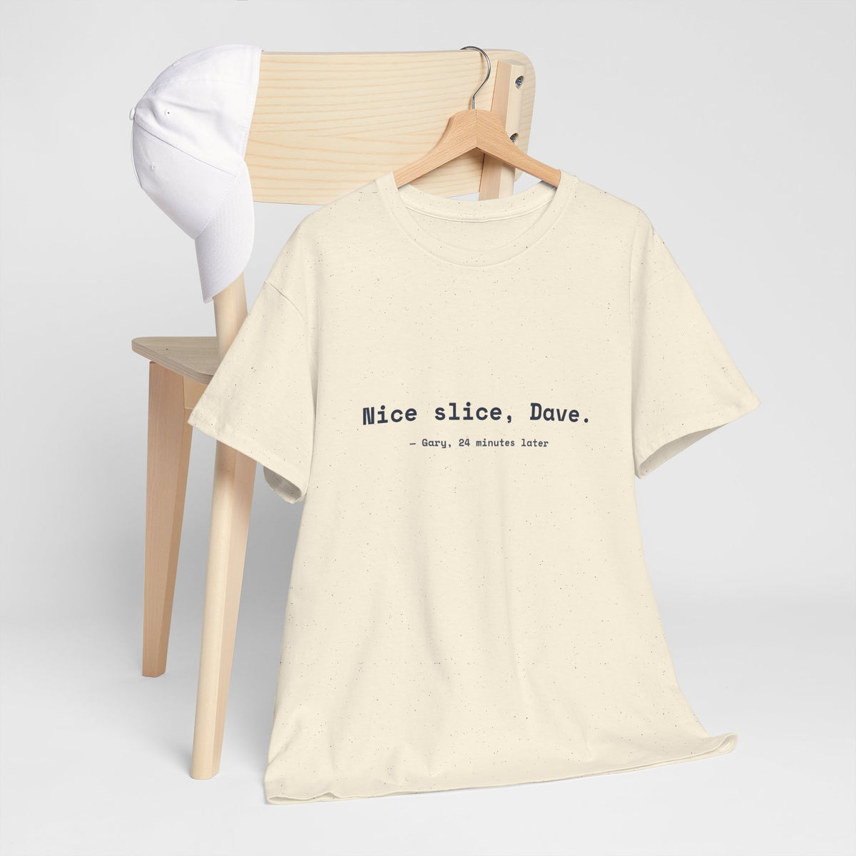Natural Nice slice, Dave. golf tee on a hanger by a wooden chair