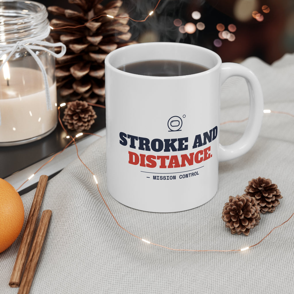 Stroke and Distance golf mug filled with coffee on a cozy holiday table