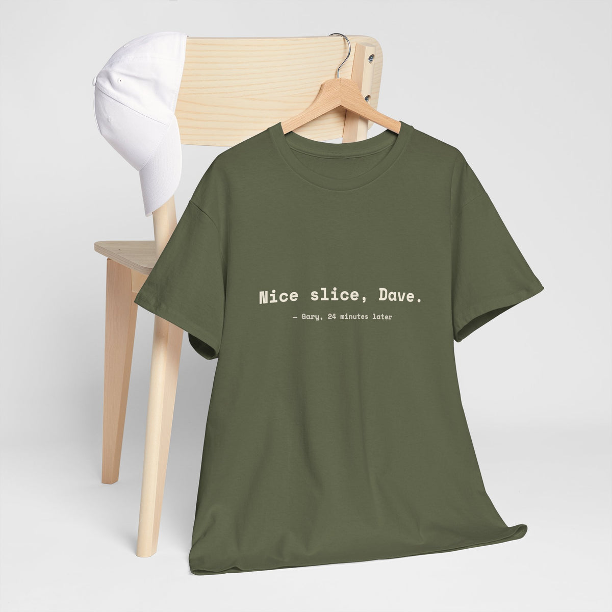 Military Green Nice slice, Dave. golf tee on a hanger by a wooden chair