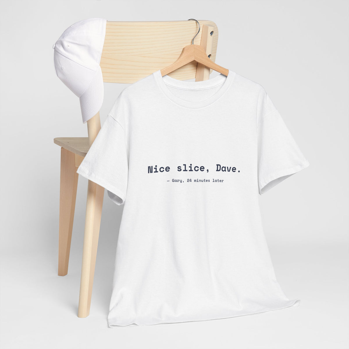White Nice slice, Dave. golf tee on a hanger by a wooden chair